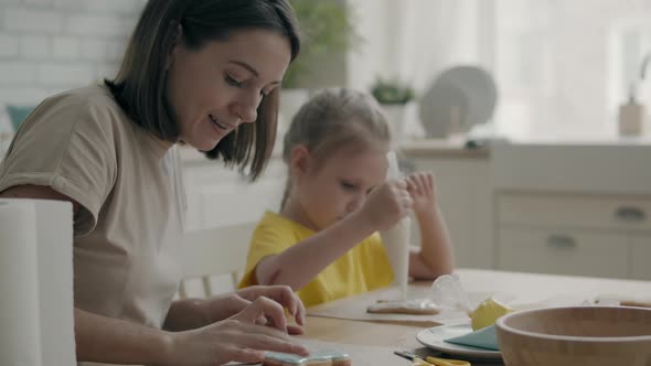 Family with a Child in the Kitchen Cooking