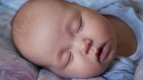 Adorable Newborn Girl with Closed Eyes Sleeps in Bed alt