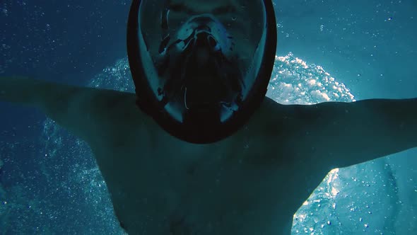 Man Swims Underwater