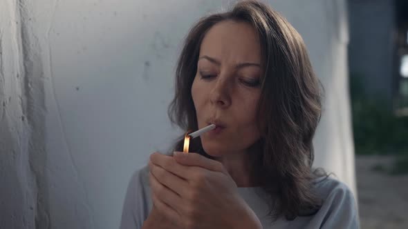 Crazy Woman is Smoking Cigarette and Laughing Outdoors Female Portrait alt