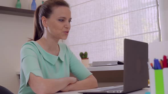 Lady Using Laptop for Video Call alt