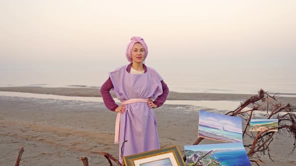 Elegant Artist Stands at Artworks Put on Broken Tree Trunk alt