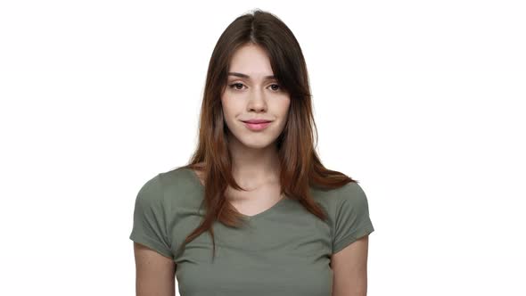 Portrait of Gorgeous Woman with Long Aubur Hair Wearing Basic Tshirt Posing at Camera with Kind alt