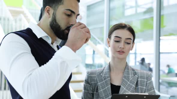 Business Center. Colleagues Talking At Office Near Stairs alt