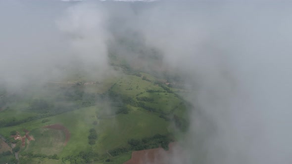 Fog morning at downtown district. Above the clouds. alt