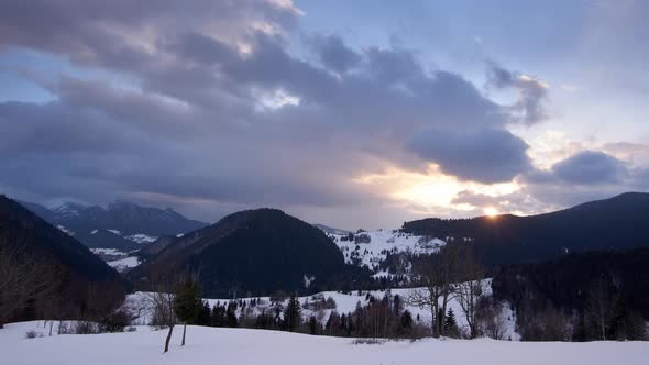 Sunset in winter ,Clouds move in the sky. . Time lapse.  clouds in the sky, alt