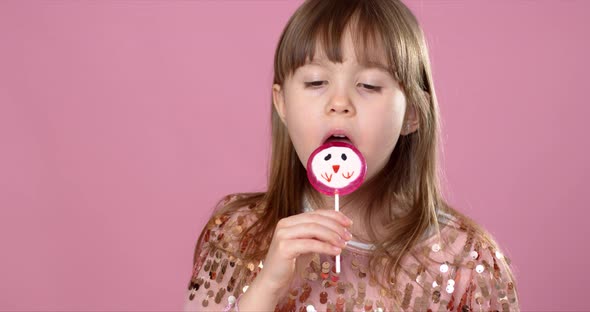 Young Happy, Smiled, Pretty Little Girl with Sweet Lollypop Candy alt