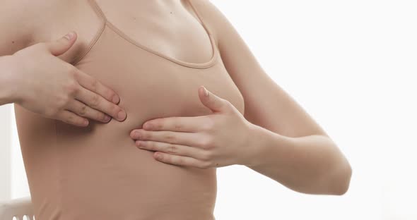 Woman Checking Her Breast for Signs of Breast Cancer. Healthcare and Mammology Concept. Close Up. alt