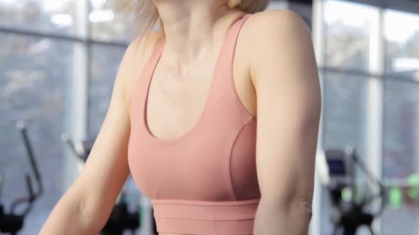 Young woman training on treadmill