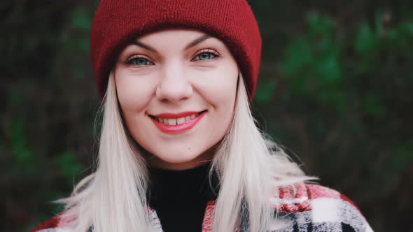 Portrait of Young Pretty Woman in Forest Winter Season alt