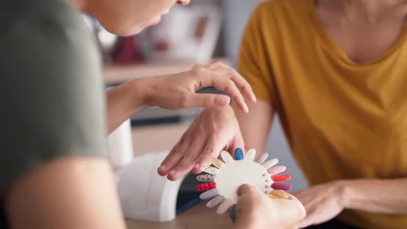 Close up video of women choosing nail color. Shot with RED helium camera in 8K alt
