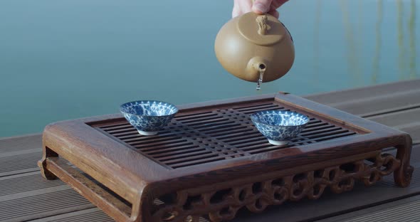 Beautiful Chinese Tea Ceremony Near Water Slow Motion Eastern Culture Style