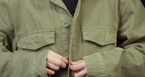 Person Buttoning the Shirt Close Up alt