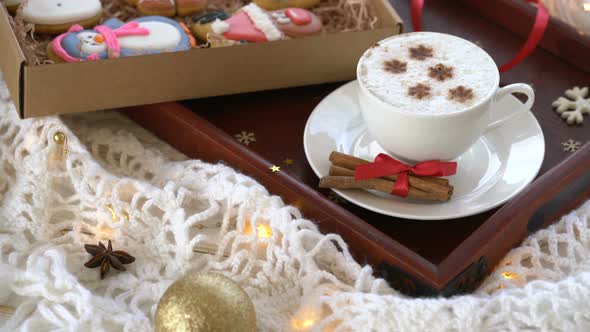 Christmas, New Year Decoration with Gingerbreads and Cup of Coffee on White Cozy Background