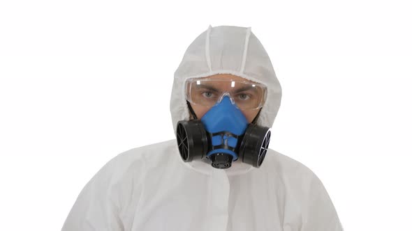 Person Wearing a Hazmat Suit and Mask Walking on White Background alt
