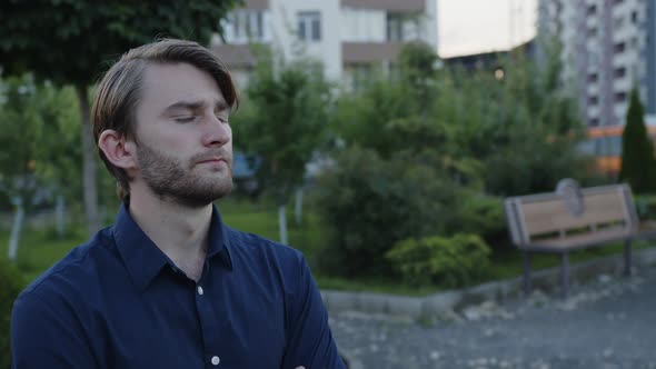 Serious Man Looks Somewhere Outdoor alt