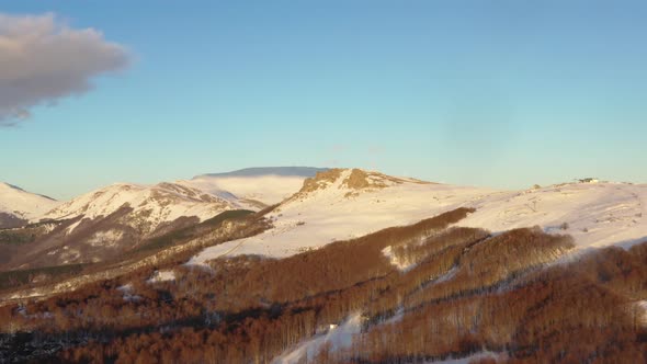 Aerial view at the mountain on a sunny winter day