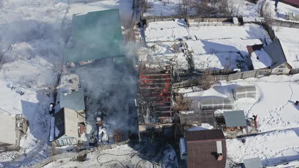 Top View Brave Firefighters Put Out a House on Fire alt