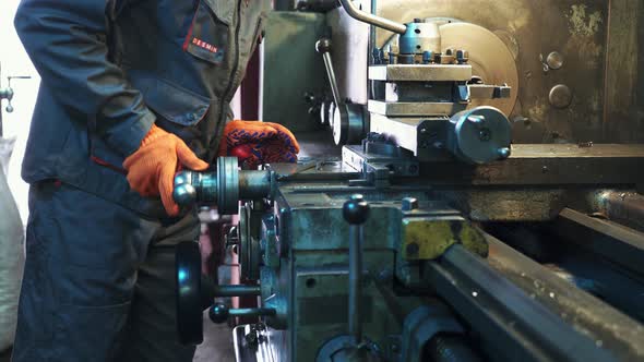 Young Mechanic working on a Lathe alt