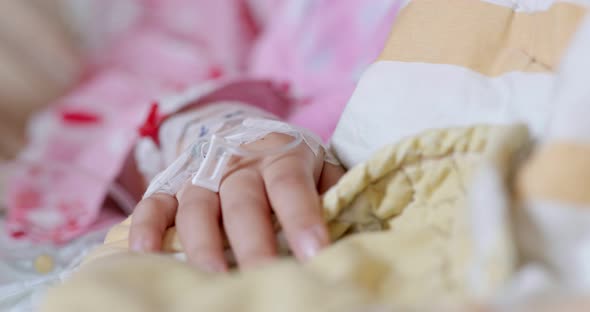 Woman get intravenous infusion in hospital alt