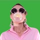 Woman with Party Glasses Chewing Gum Make Bubble On Green Background - VideoHive Item for Sale