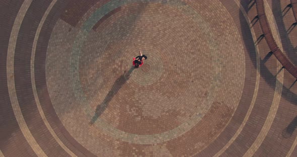 Professional Dancers Dance Tango on a Cobbled Street. Aerial View Video From Copter. Top View. alt
