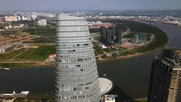 Aerial view around the Saigon Skydeck, in sunny Ho chi minh, Vietnam - orbit, drone shot alt