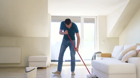 Man with Mop Cleaning Floor at Home 39 alt