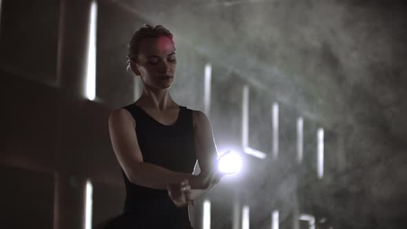 Prima Ballet Company in a Dark Dress on a Dark Theater Stage Rehearsing in the Smoke Performs Dance alt