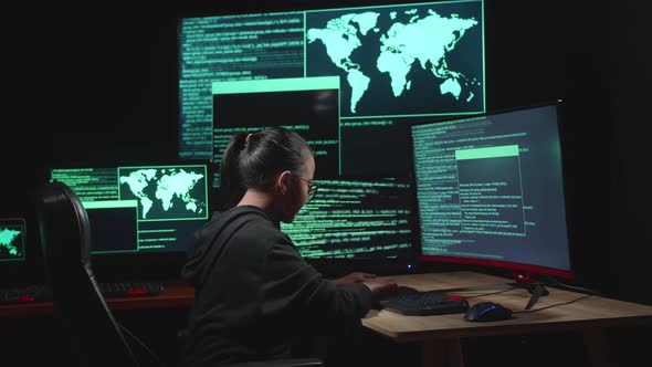 Asian Young Girl Hacker Hacking With Multiple Computer Screens In Dark Room alt