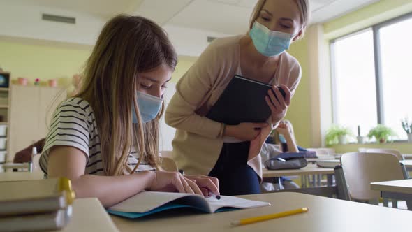 Video of school children with hands raised in classroom.  Shot with RED helium camera in 8K alt
