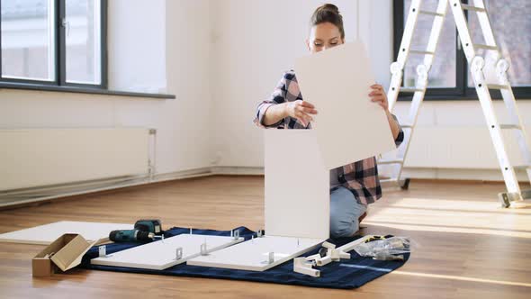 Woman Assembling Furniture at Home alt