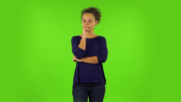Curly Woman Focused Thinks About Something, No Idea. Green Screen alt