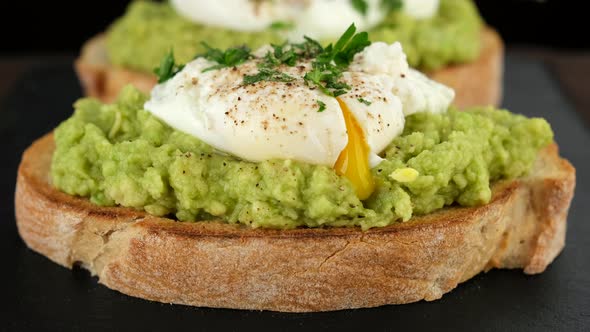 Avocado toast with poached egg close up alt