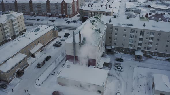 Chimneys on the Roof of a Multistorey Building in the Harsh Cold Winter in the Arctic City During