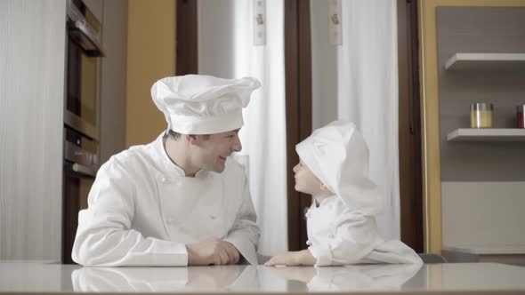 Young Baby Chef Makes the Tongue to His Dad