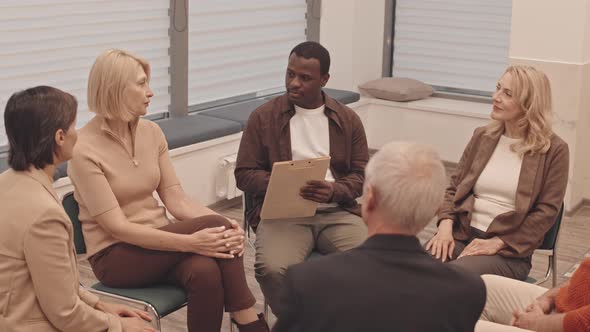 Mature People at Support Group alt