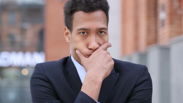 Young African Businessman Upset By Loss While Working in Office alt