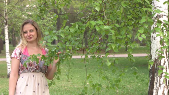 Portrait of Woman Near Birch alt