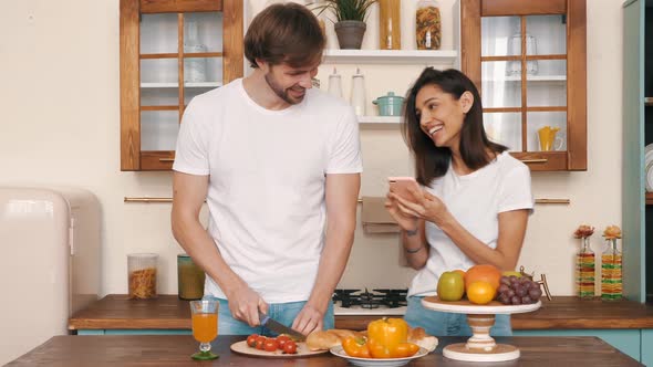 Happy cheerful loving family having tender moments in the kitchen  alt