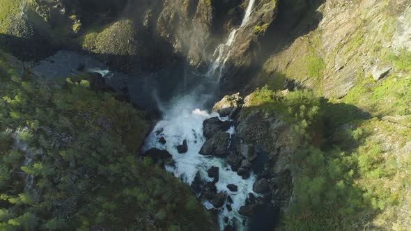 Voringfossen Waterfall and Cliffs with Trees in Norway alt