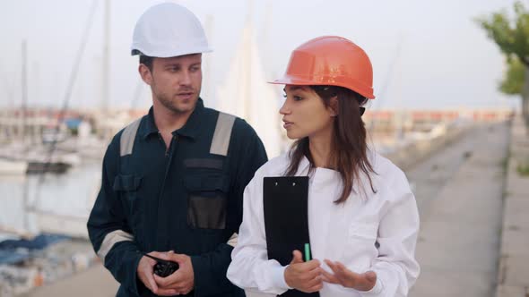 Man and Woman Yacht Port Workers at Marina Dockside alt