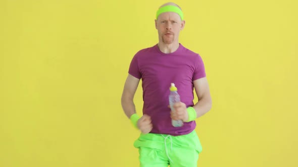 Funny Man Is Running with Bottle in Hands and Breathing, Sportive Humor