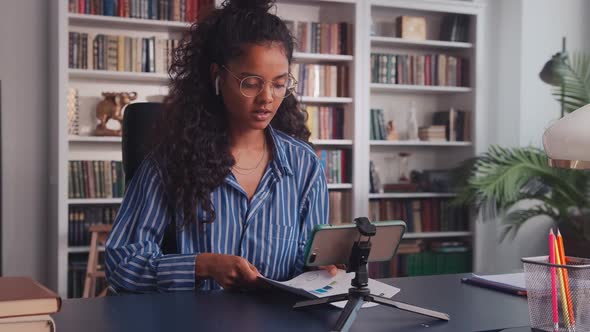 Young Indian Woman in Video Call Online Conference By Phone Talking to Colleague alt