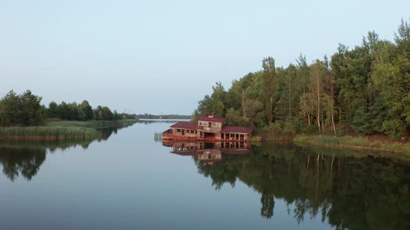 Aerial Shot of Rusty House on Water, Pripyat River alt