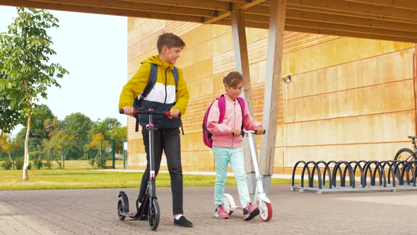 Happy School Children with Backpacks and Scooters alt