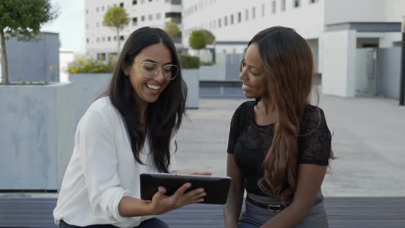 Multicultural Businesswomen Using Digital Tablet in City alt