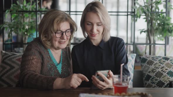 Mother and Daughter Met in a Restaurant alt