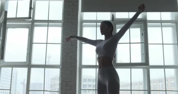 Professional Yoga Practitioner Lady in Grey Sports Suit alt