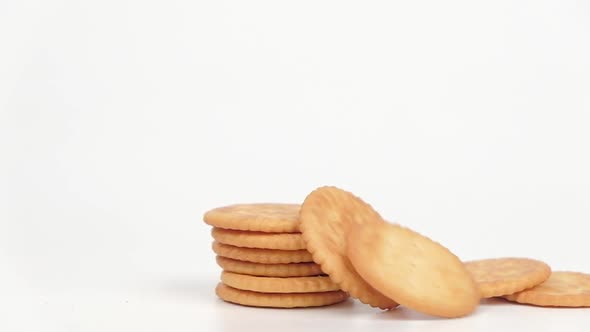 Slow motion Biscuits Cookies stacks fall on a white background